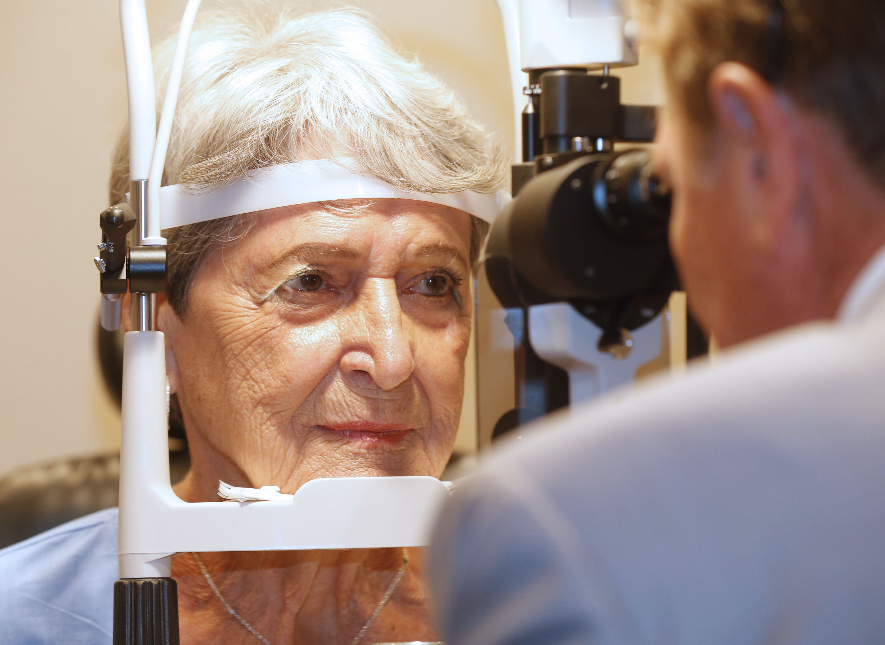 eye doctor examining patient's eyes