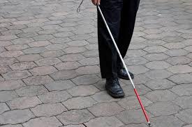 man with white cane